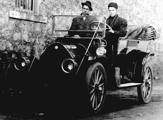 Postcard with Andrew at the wheel of a 'buggy'